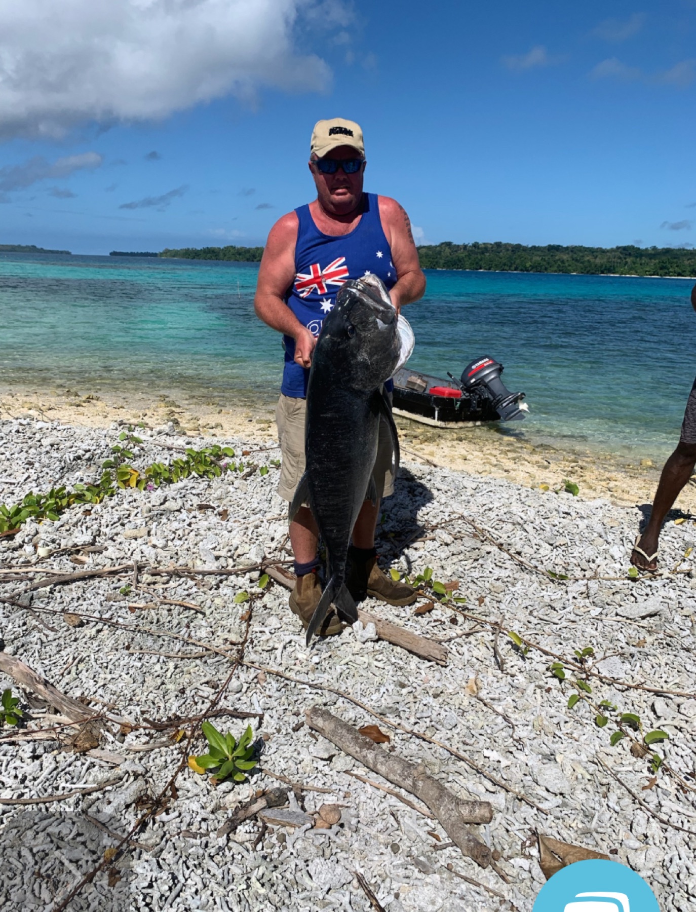 Angler holding a giant trevally caught on an Aore Sport Fishing charter, Vanuatu 4