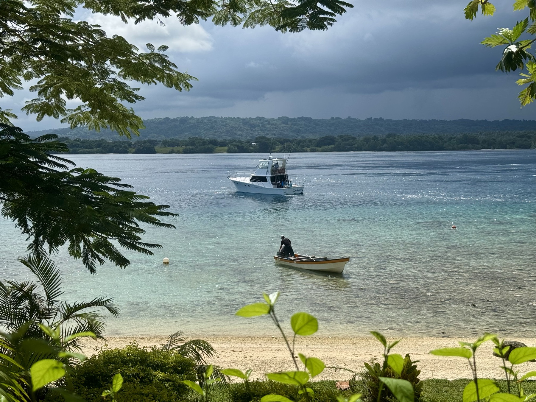 Lapita Beach boat moored on the calm lagoon, ready for guest transfers